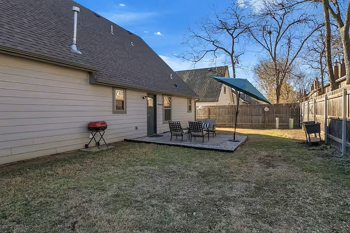 BACK YARD - PATIO W/ SEATING, FULLY FENCED YARD, CHARCOAL GRILL