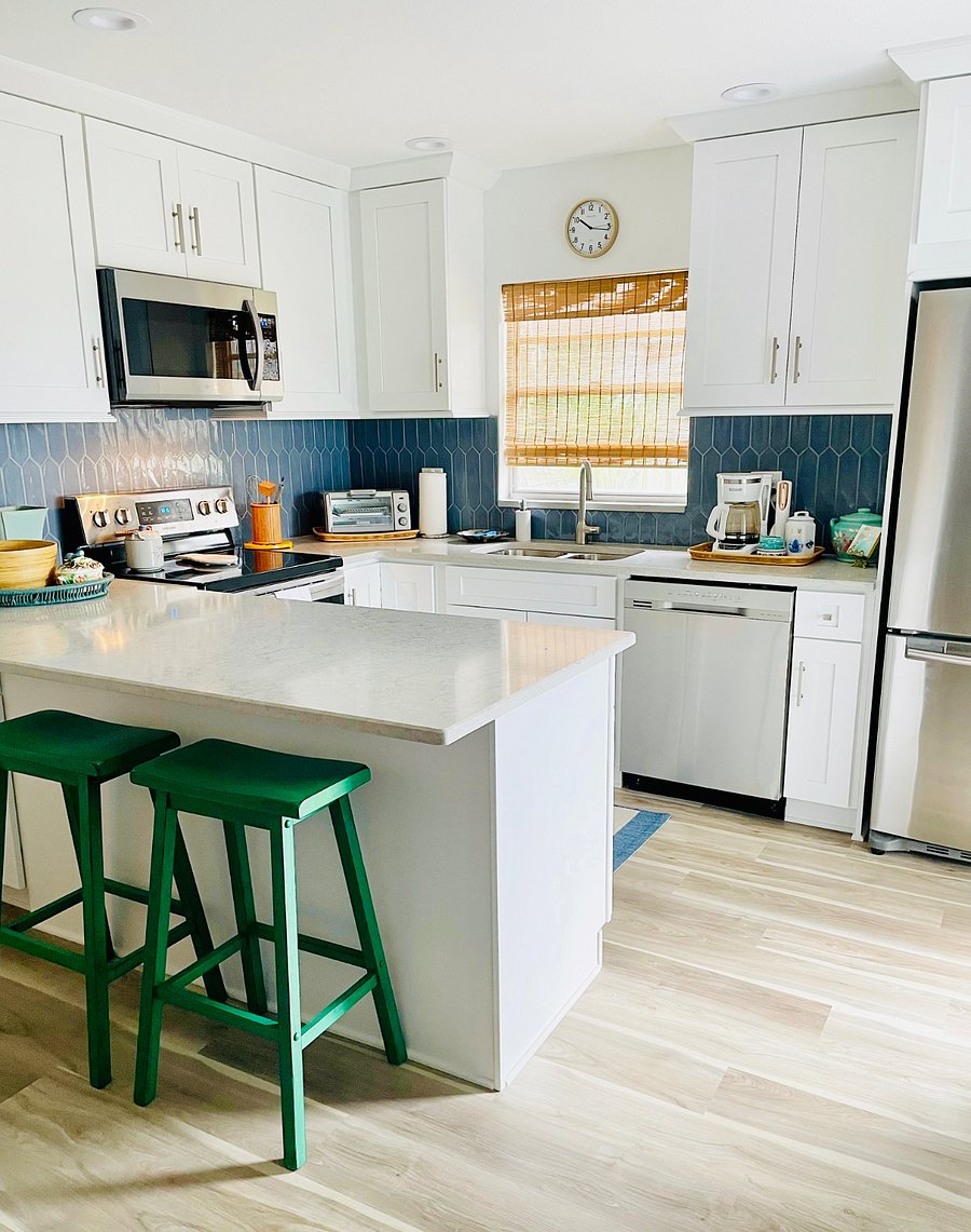 Adjacent to the kitchen is a breakfast table with 4 comfy chairs for dining. 