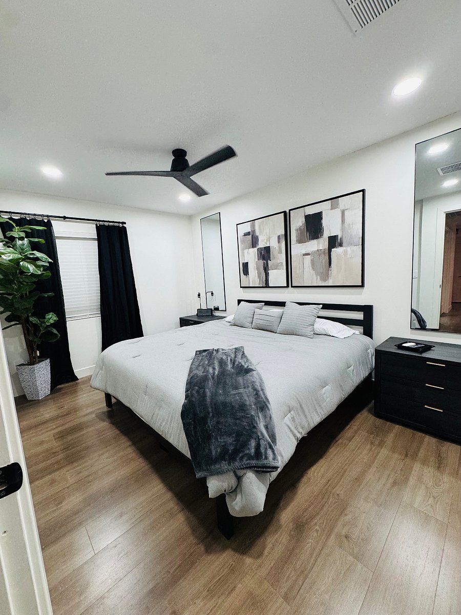 Bedroom #2: Kind Size bed, blackout sleep curtains, two dresser nightstands, and double door closet. Smart TV.