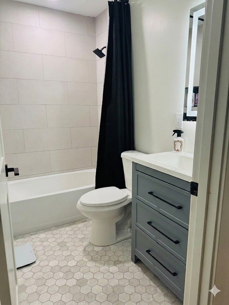 Full bathroom with tub, shower, vanity, and LED mirrors