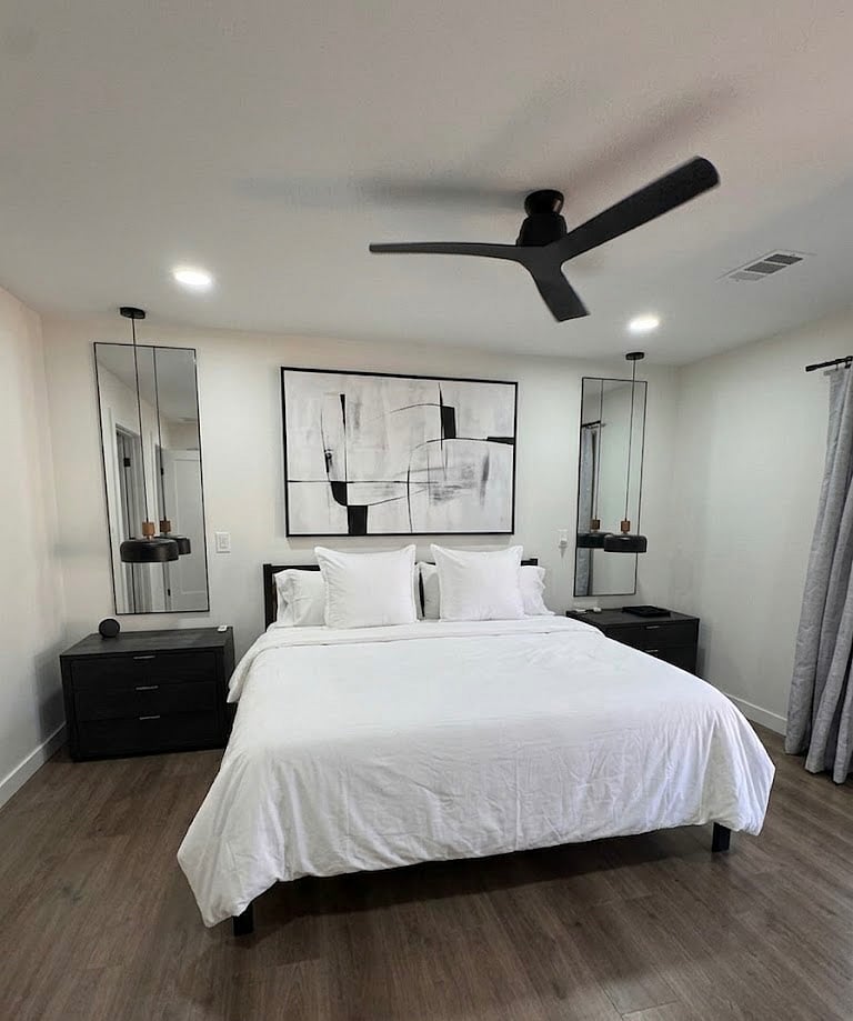 Bedroom # 3: Master Bedroom. In suite bath with shower, vanity and LED Mirror. King bed. Two dresser style nightstands. Double doors to patio.