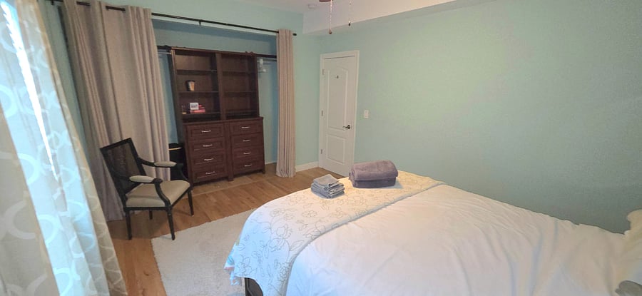 Main floor bedroom with queen bed