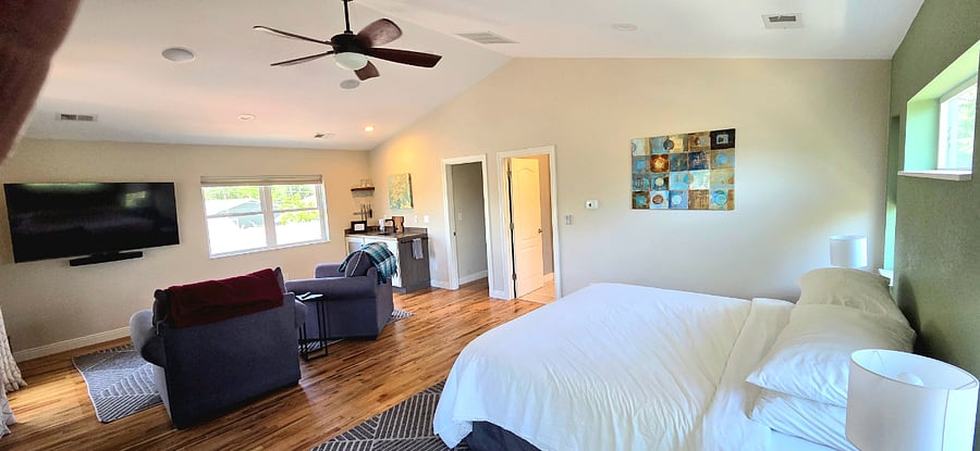 765 sq ft luxury bedroom suite with 13' ceiling ans Sonos sound system with overhead indoor-outdoor speakers, beam soundbar, and sub-woofer