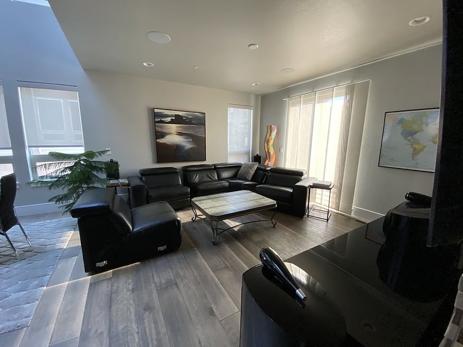 Living room with electronic reclining couches.