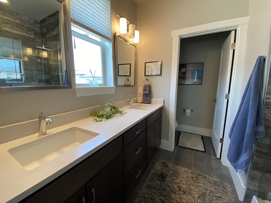 Master bath with double vanity, extra-large shower with seat.