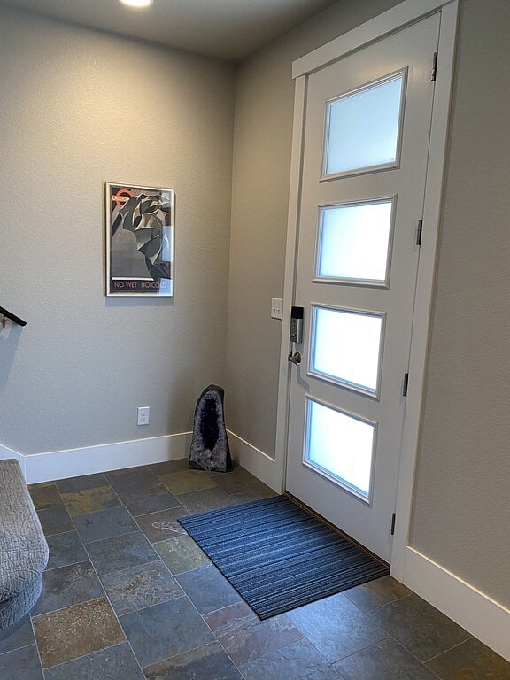 1st floor entry with 1st floor bedroom to left.