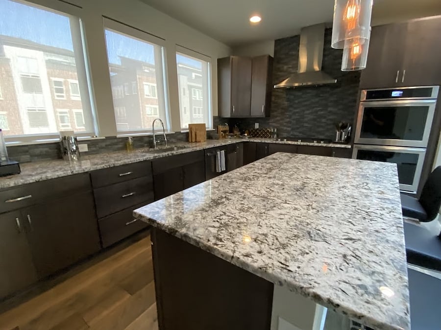 Granite countertops, and chef's kitchen. Microwave under the center island.