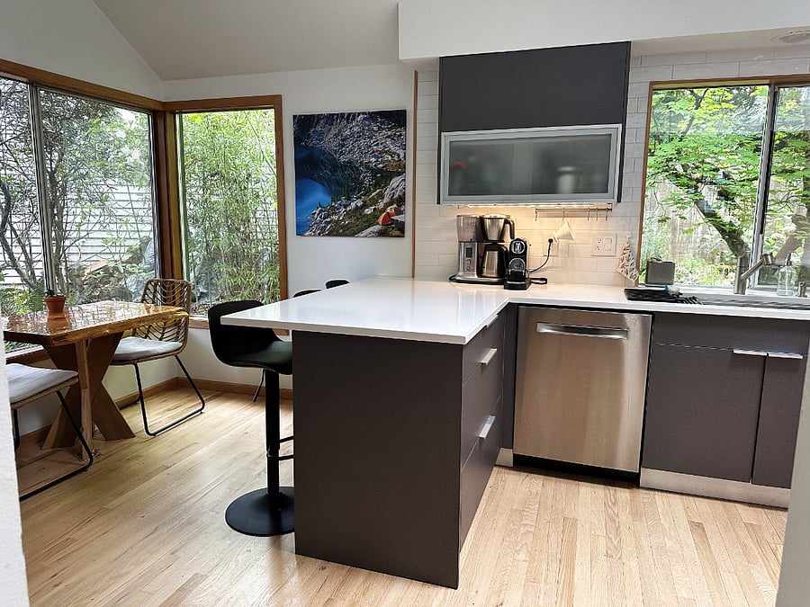 Kitchen breakfast nook with corner window.