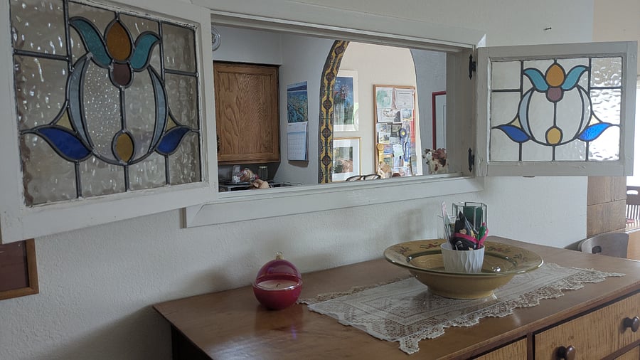 Pass-through window between living room and kitchen