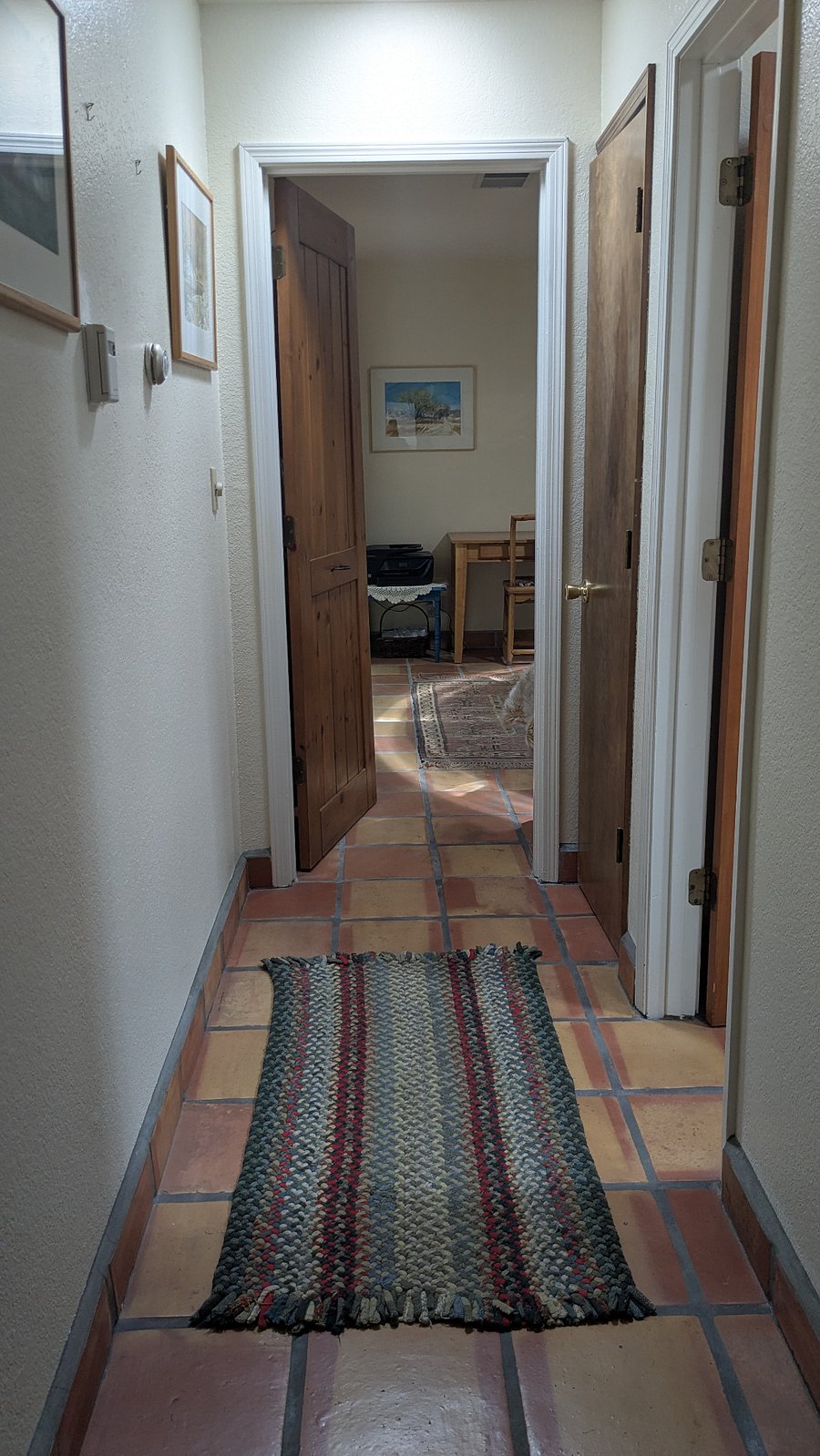 Hallway to a private suite-like bedroom and private bathroom