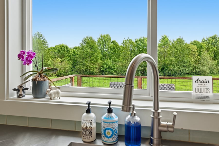 Stunning views out stainless steel sink seamlessly integrated into stainless countertop for clean look and exceptional sanitation.