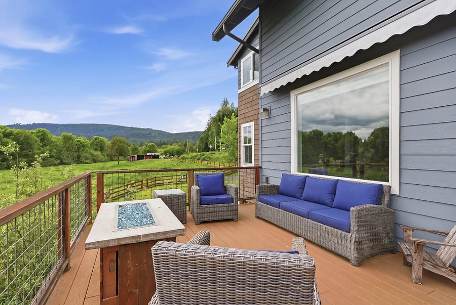 Private back deck only accessible from inside the home with three large retractable awnings for sun or rain, full patio set, outdoor table and chairs with seating for 8 people, propane grill, propane fireplace.