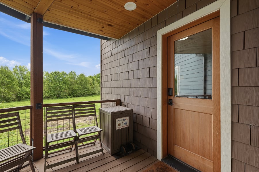 Covered breezeway to enter mudroom. Ring camera here. 