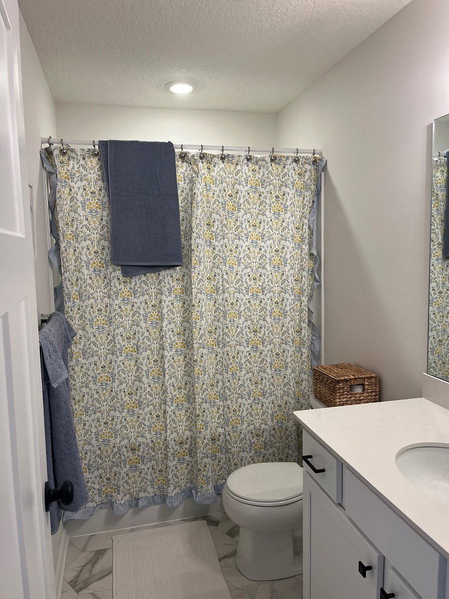 Bathroom with shower and tub, all brand new towels and some toiletries provided.