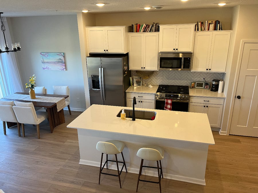 Kitchen space when coming down the stairs, fully stocked with all necessities for cooking.