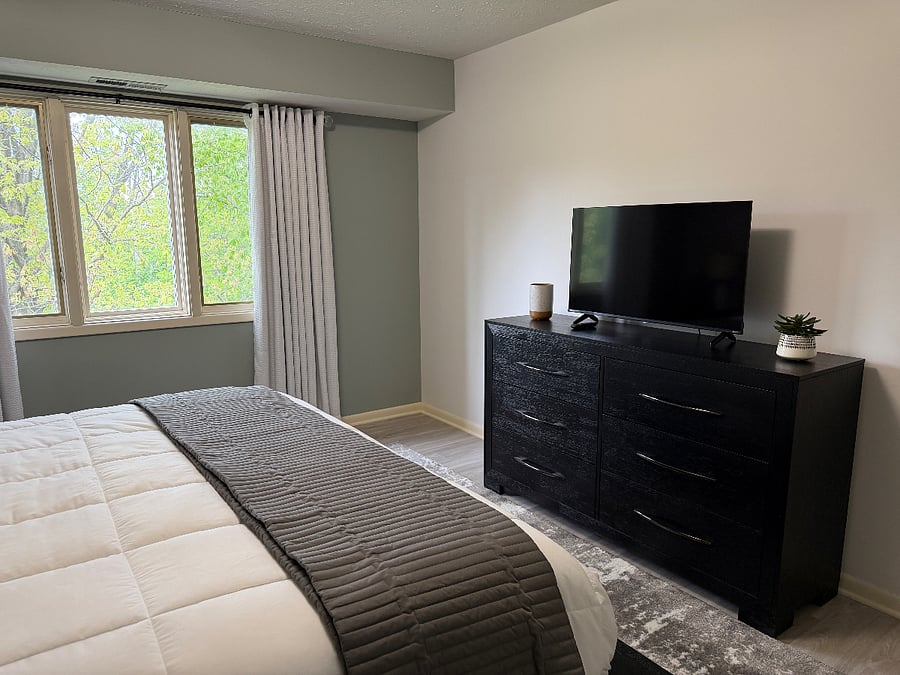 Primary Bedroom Dresser, Blackout Curtains and TV