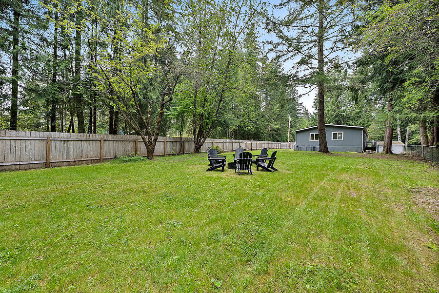 Large fenced yard with firepit. No pets allowed - but a great contained space for kids!