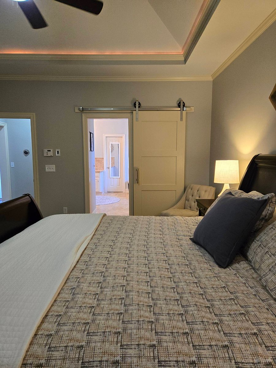 Master bedroom - ground level with sliding barn door to bath and walk-in closet