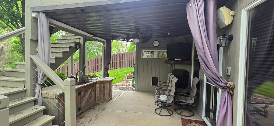 Lower rear bar with water/sink, gas heather and tv above mantle.