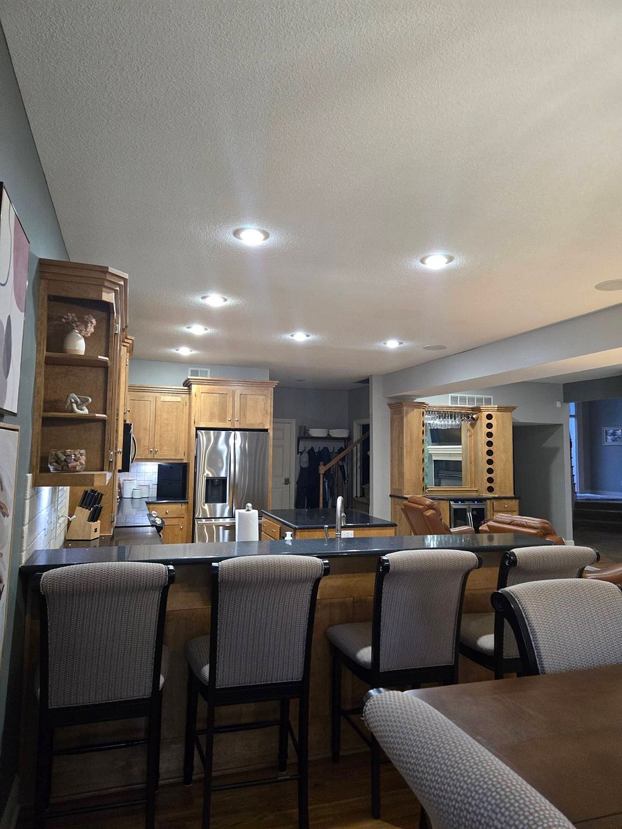 Dining area looking into kitchen and hearth room