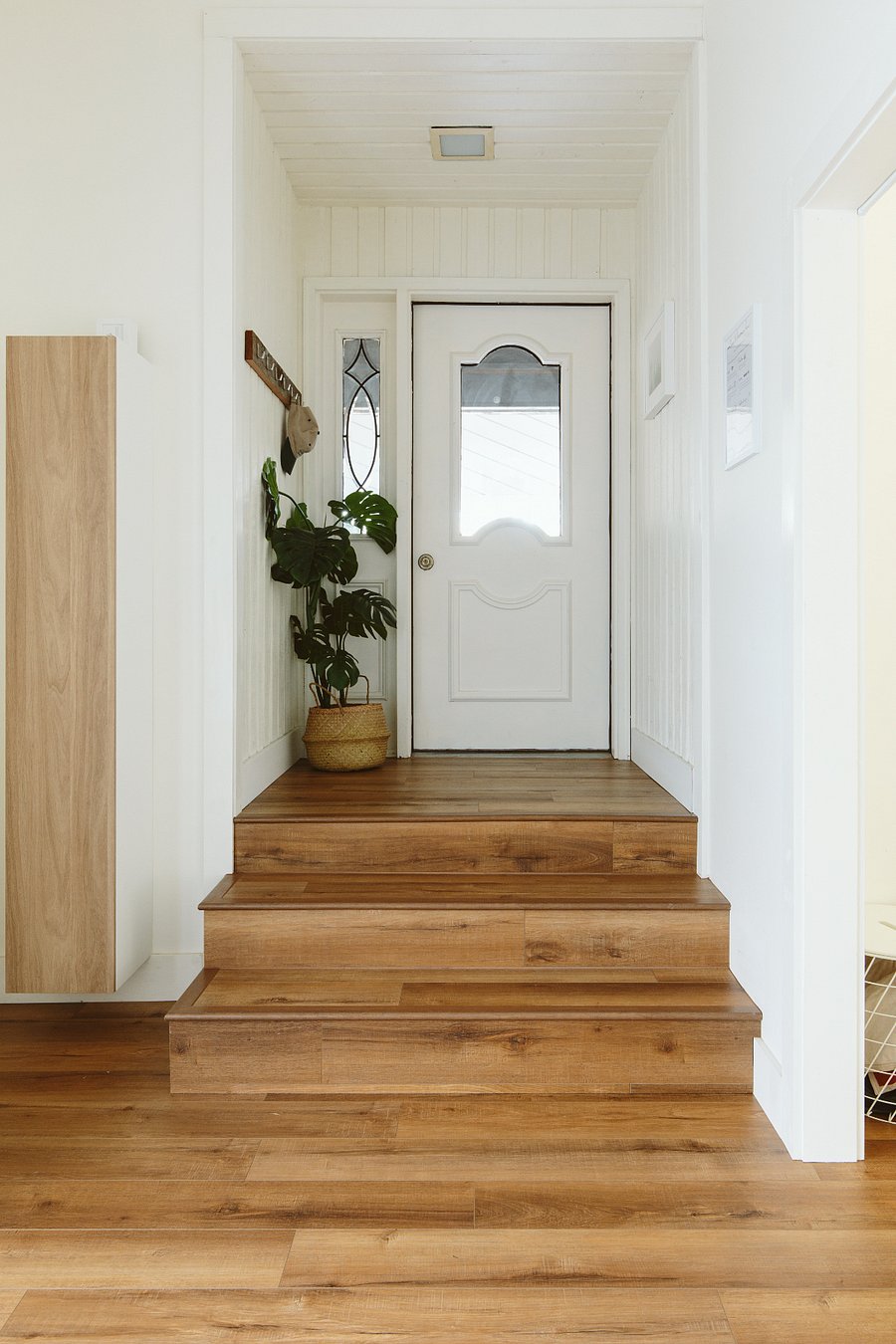 The door between the Entry / Playroom and main level. Also the original front door.