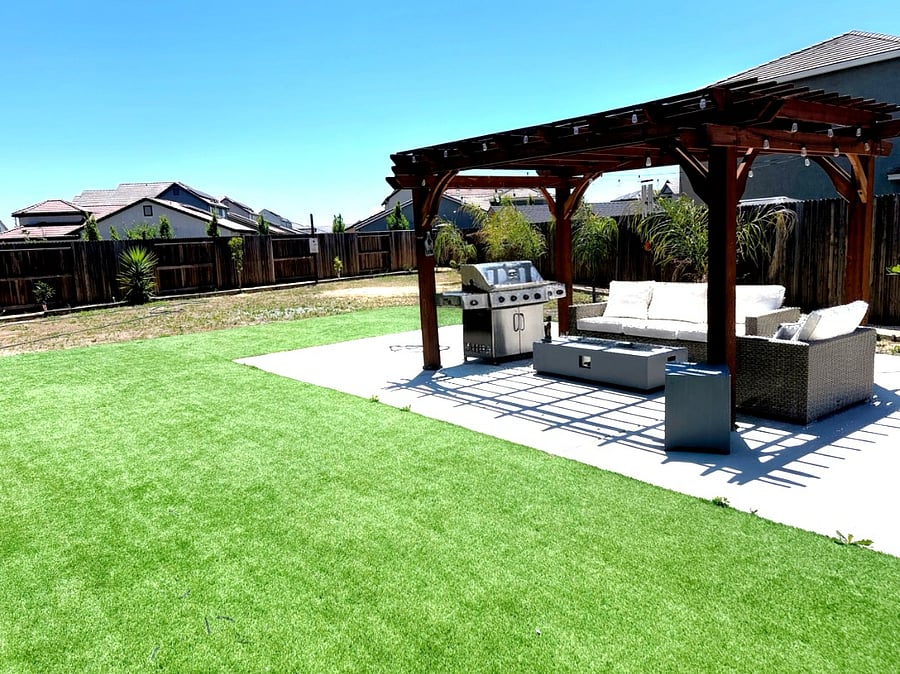 Backyard w/ Pergola sitting area & BBQ  can be moved to desired areas