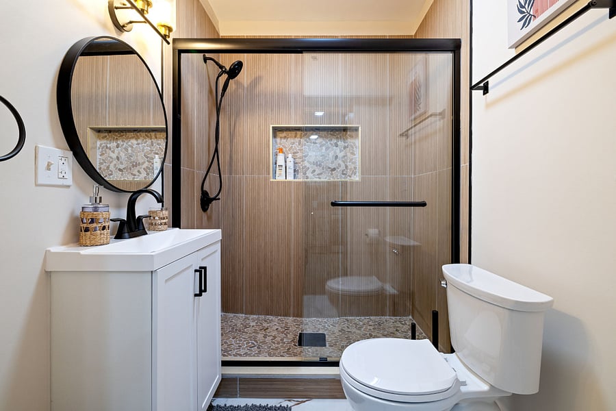 Spa-theme shower, vanity and toilet.