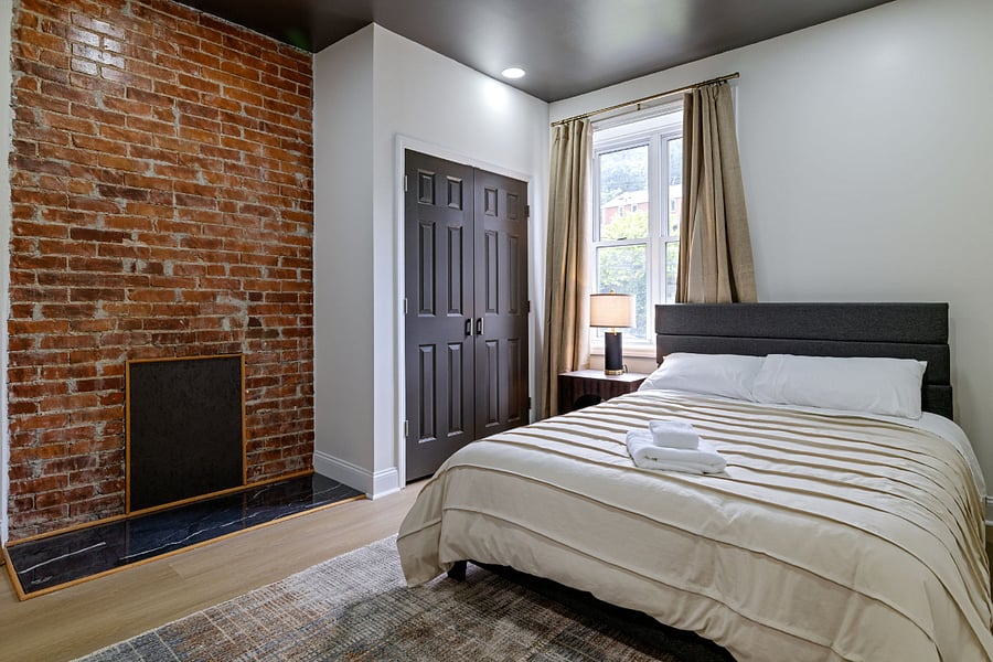 2nd bathroom with queen size bed and closet