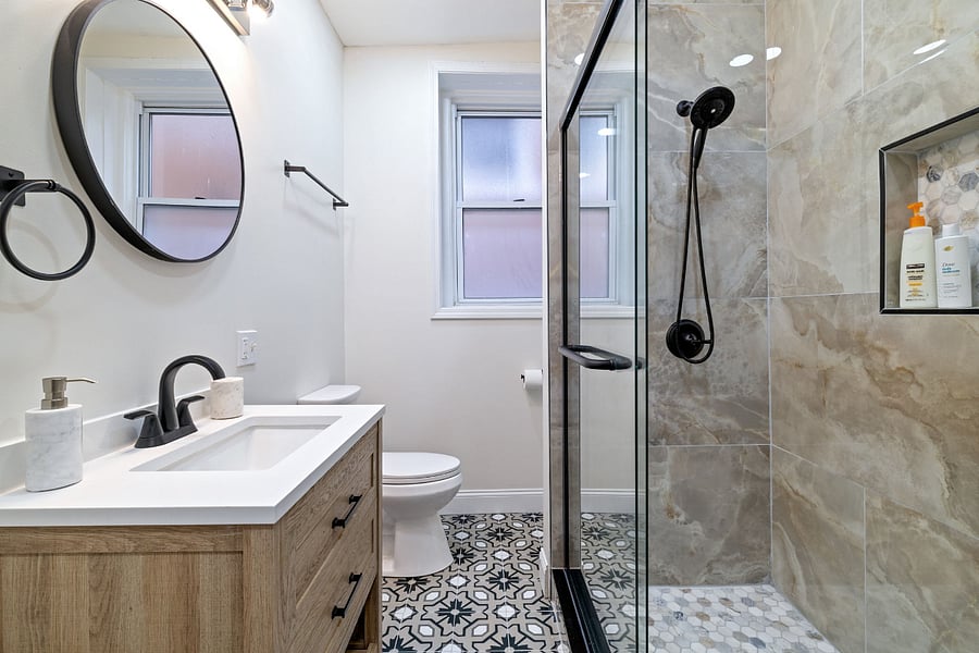 Bathroom with shower, vanity and toilet.