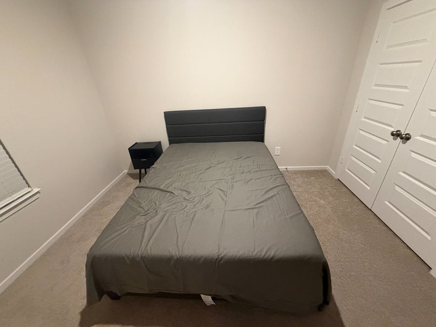 Bedroom with nightstand and closet