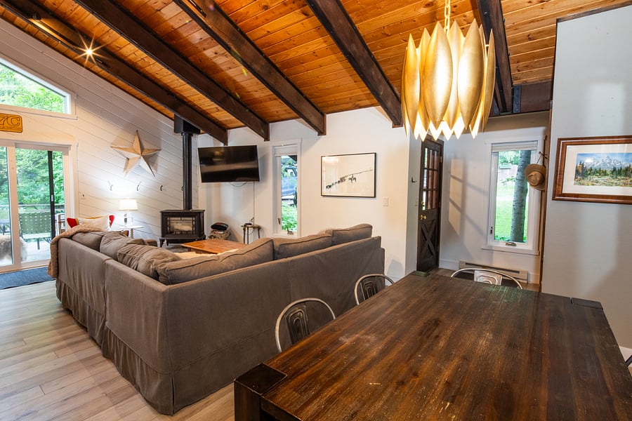 dining area with view of living room and sliding door that goes to the deck and yard