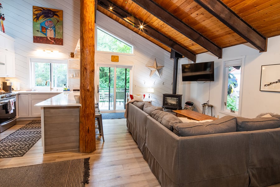 kitchen and living room with slider that goes to deck and yard