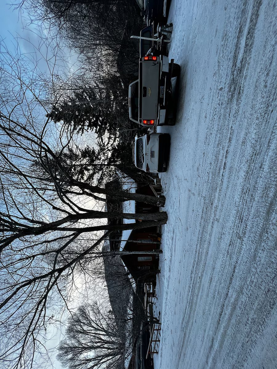 view of off street parking in winter