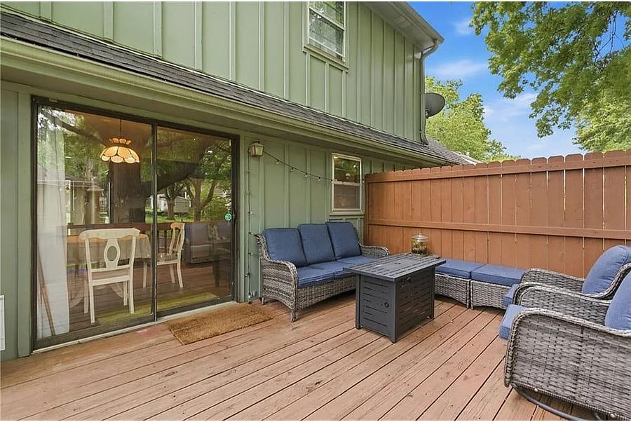 Private outdoor deck with comfortable seating, perfect for morning coffee, evening conversations, or relaxing after a day exploring Kansas City.