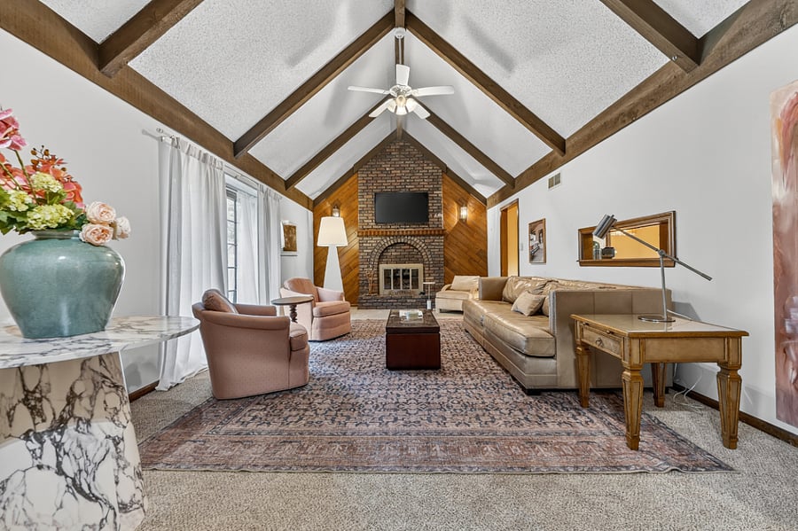 Bright vaulted living room filled with natural light, elegant decor, and plenty of space to unwind.
