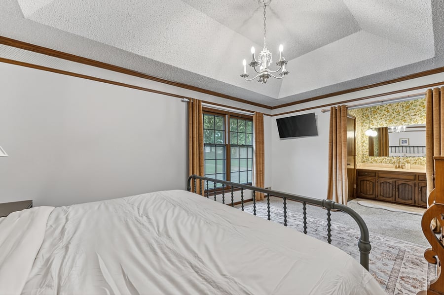 Comfortable bedroom retreat with natural light, cozy textures, and a calm inviting ambiance.