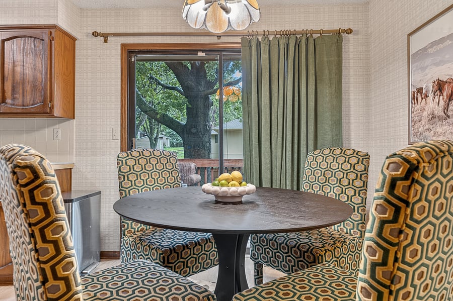 Peaceful breakfast area with large windows, soft natural light, and relaxing outdoor views.