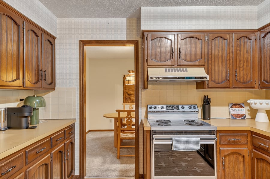 Charming kitchen entry with warm wood cabinetry and a welcoming layout full of character and functionality.