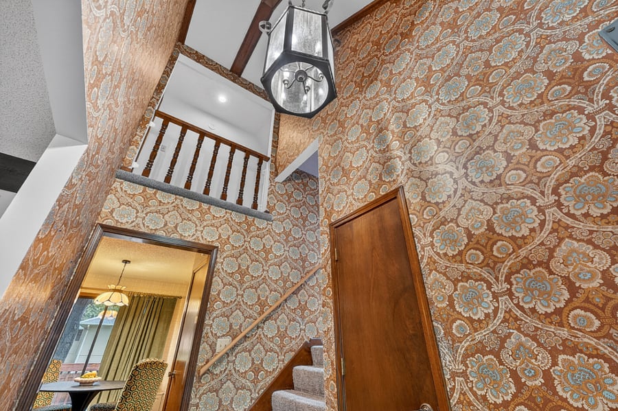 Beautiful overhead staircase view showcasing unique architectural details and charming vintage style.