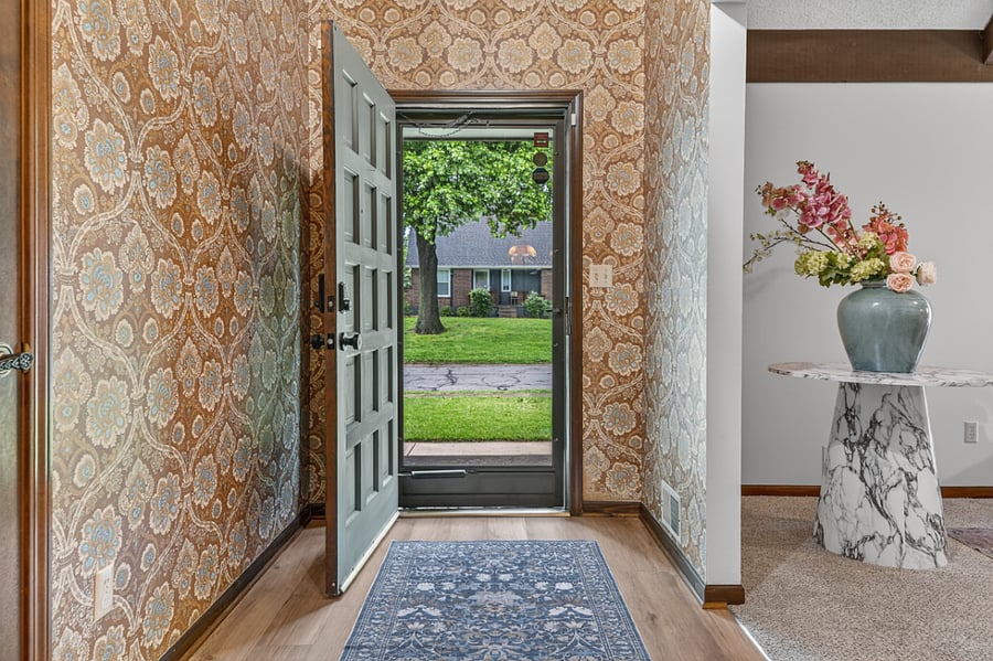 Bright front entry with natural light and welcoming curb views creating a warm first impression.