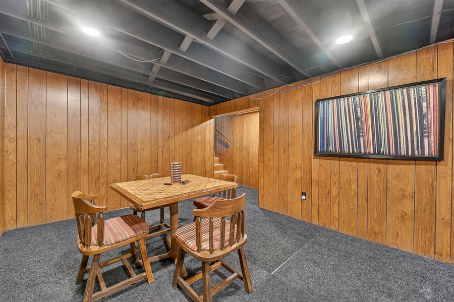 Cozy game and dining area perfect for board games, casual meals, or late night conversations.