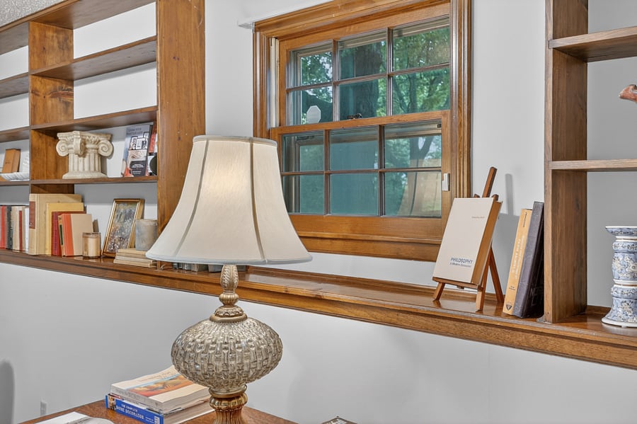 Bright desk area beside large windows creating the perfect environment for reading or remote work.