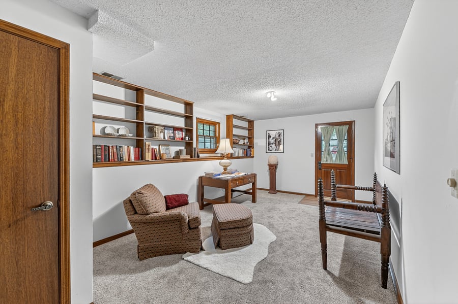 Spacious flex room perfect for a home office, reading lounge, creative studio, or quiet retreat.