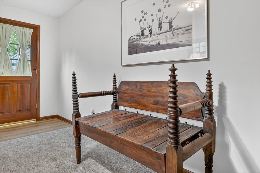 Charming wooden bench seating creating a cozy and inviting space near the entryway.
