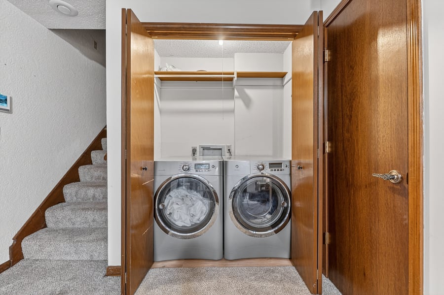 Convenient in home laundry area with full size washer and dryer, offering comfort and ease for extended stays.