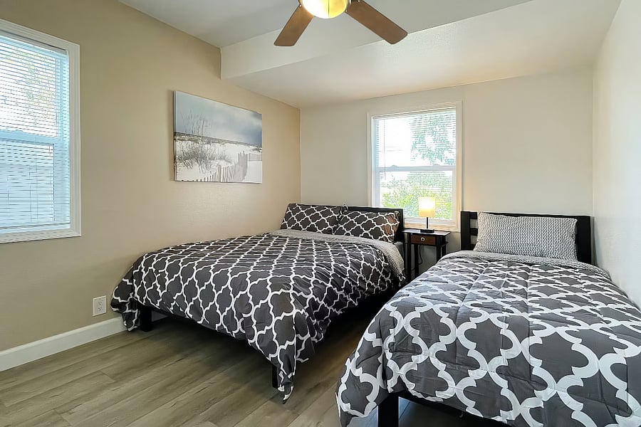 Bedroom #1 with 1 double size and 1 single size beds with very comfortable 12" medium firm memory foam mattresses. Ceiling fan in bedroom.
