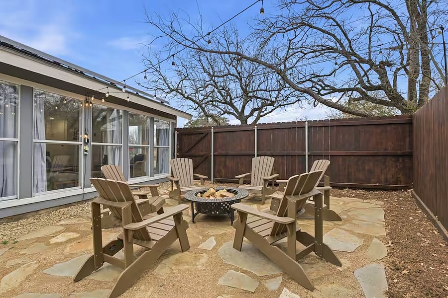 South side with fire pit and exterior lights.