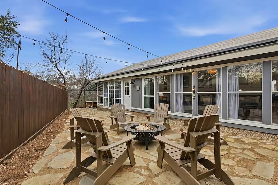 South side with fire pit and exterior lights.