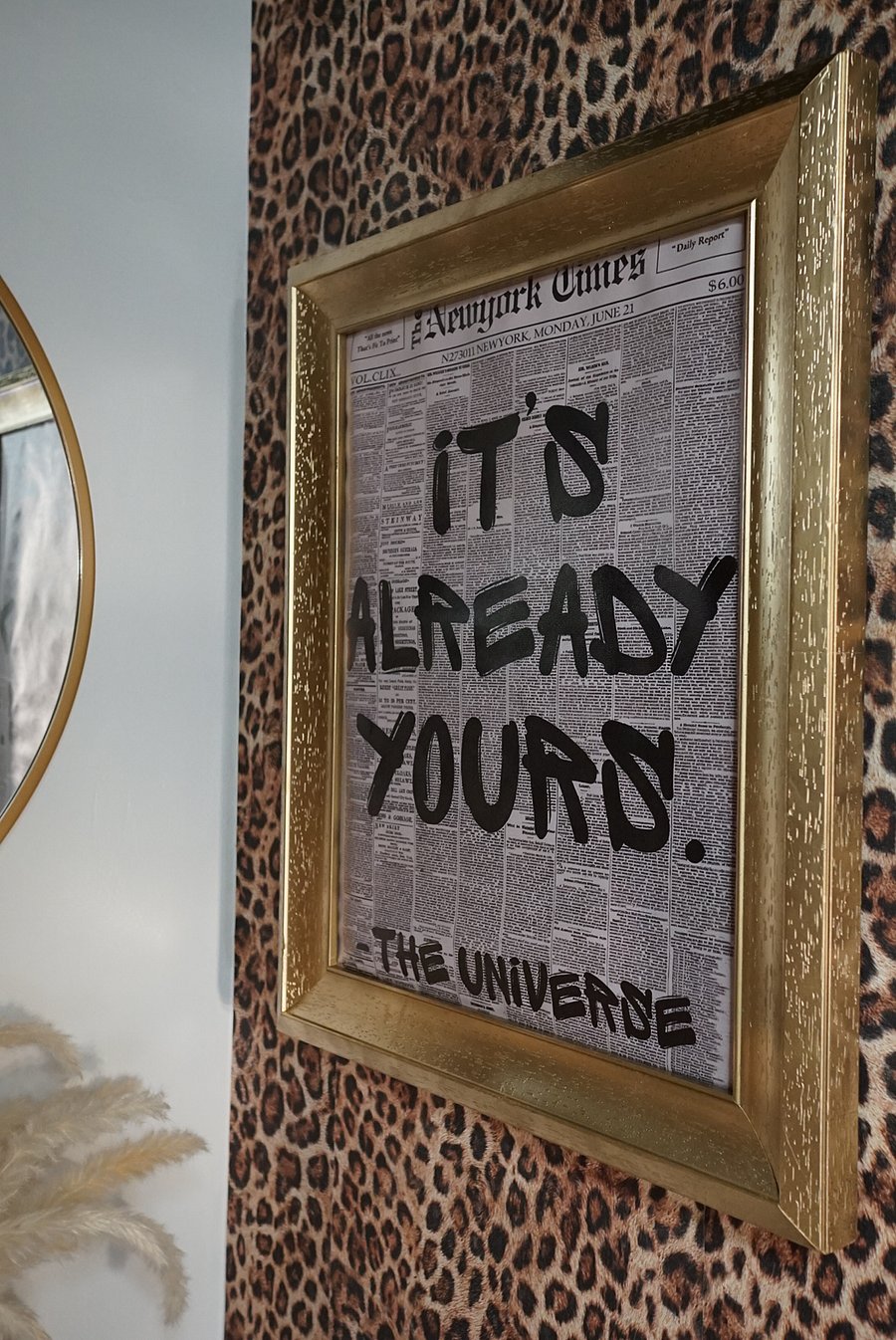 Downstairs (main level) Half Bathroom. Featuring custom leopard print wallpaper, black vertical tiling, & custom curated art to create a distinct visionary experience for guests + tenants. 