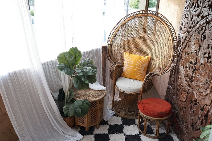 Upstairs (Bedroom 2) personal patio space. Features a true vintage Art Deco (circa 1920s) hand woven Peacock Chair shipped to US from Japanese immigrants during the Depression. This outdoor space has been designed to emphasize peace, tranquility, and resort-like vibes. A personal slice of tranquil Heaven that is yours to use for occupants of Bedroom 2. A 3 panel hand carved Balinese wood frame accents the main wall of the patio, and can serve as a backdrop for yoga, meditation, or personal enjoyment. 